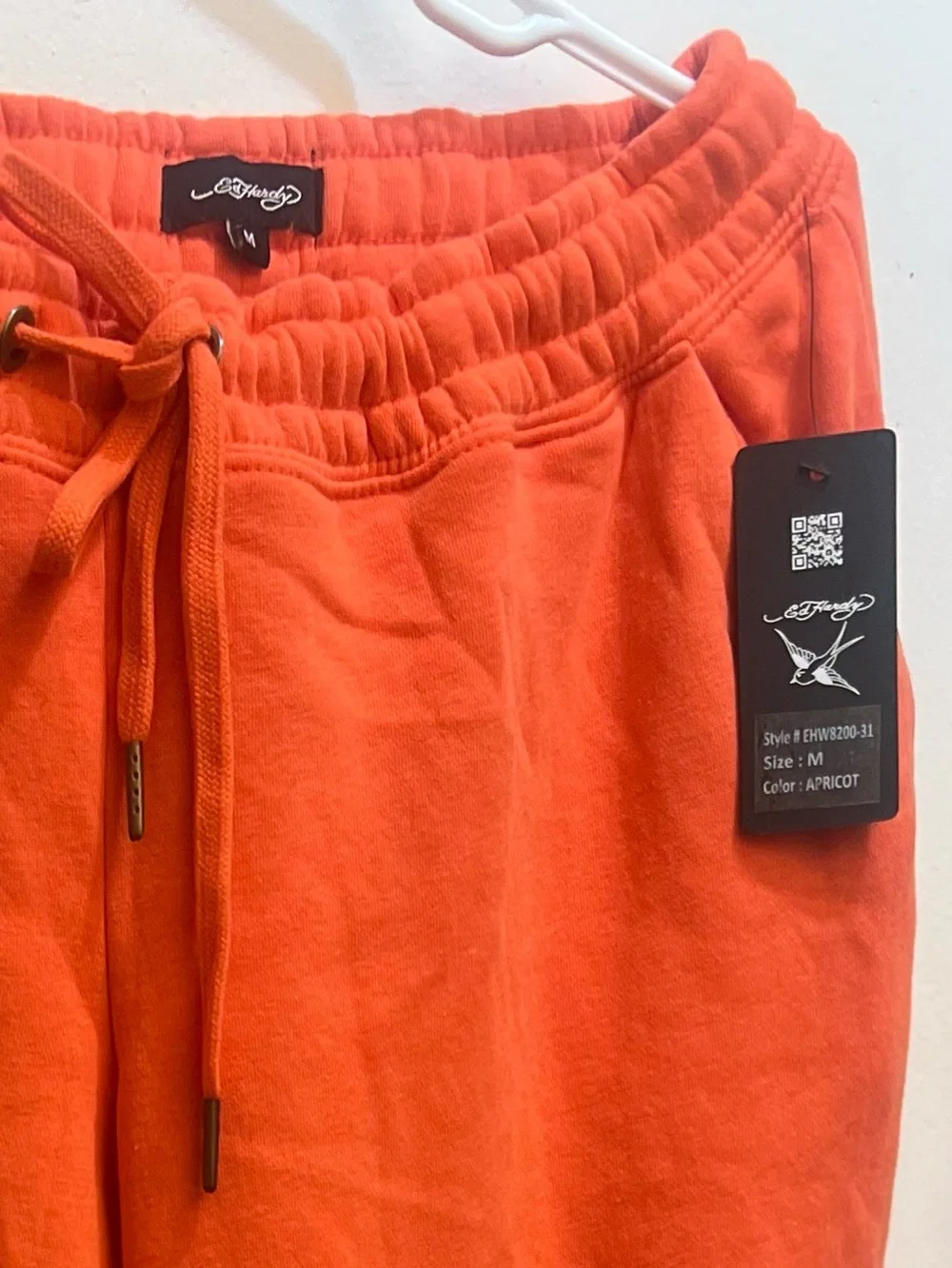 This Vibrant Orange Ed Hardy Drawstring Sweat Pant is Available 🧡